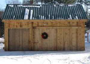 Beam barn covered with snow