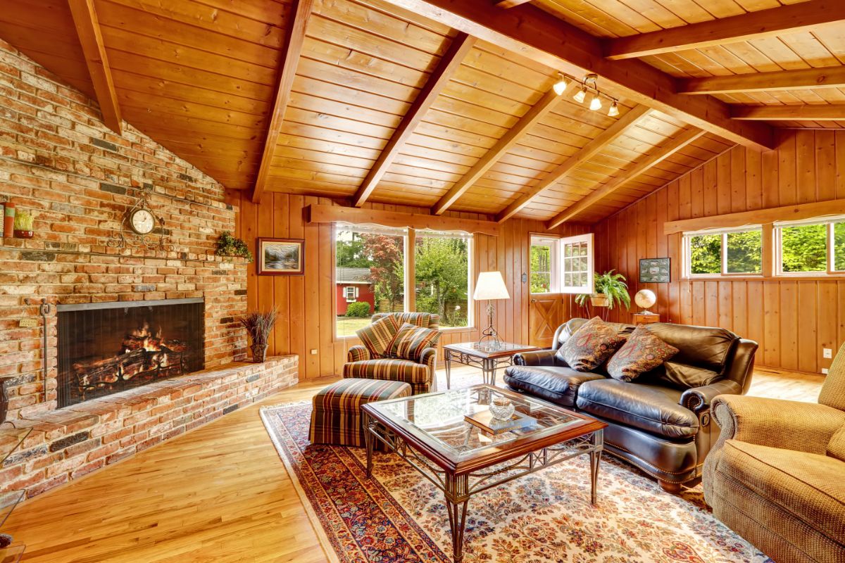 log cabin interior with couch and fireplace