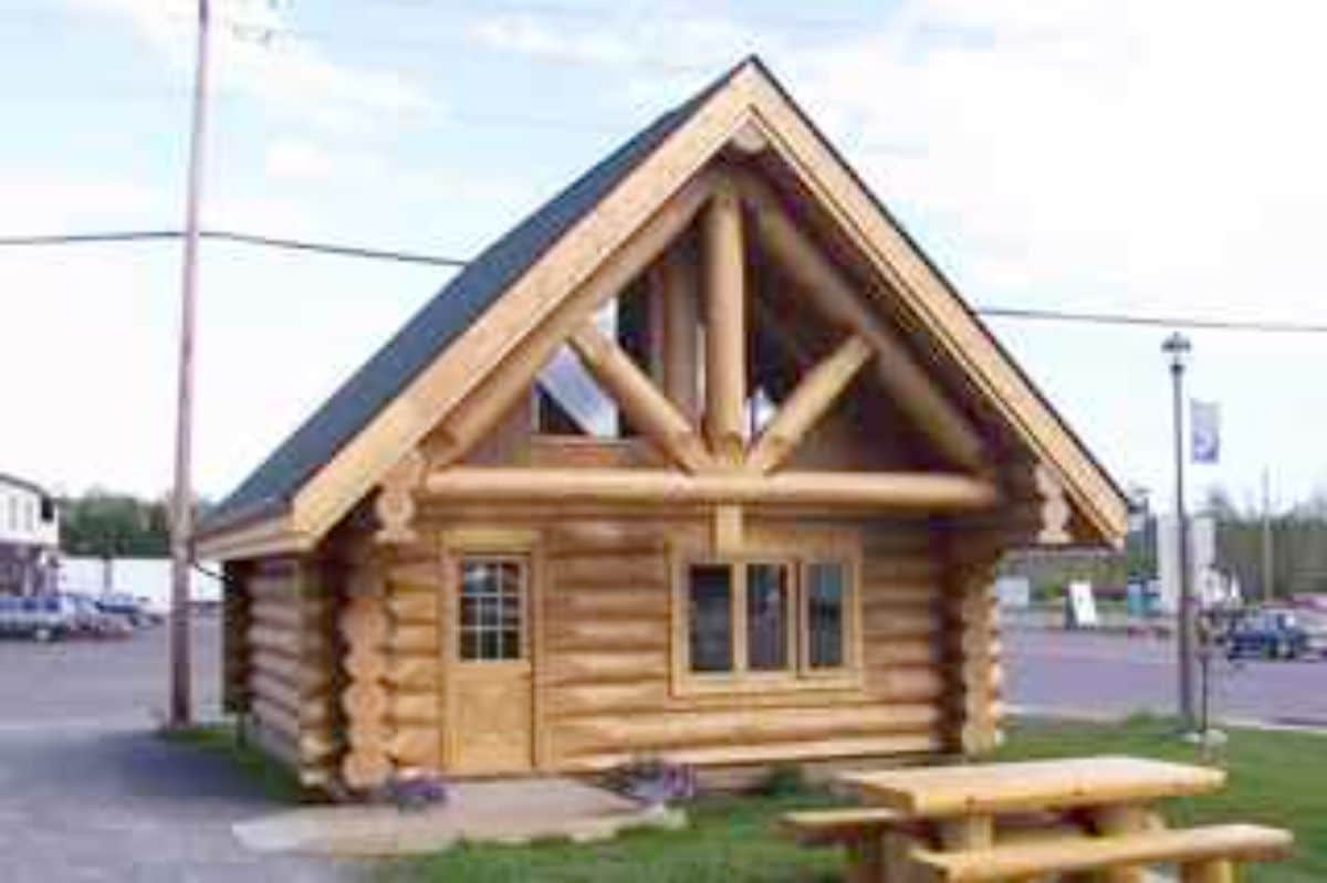 small log cabin in a town