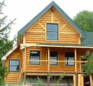 big log home surrounded by trees