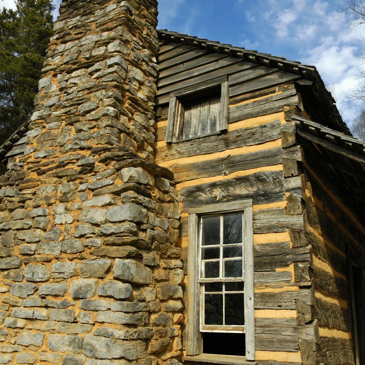 close up of a small window in a log cabin