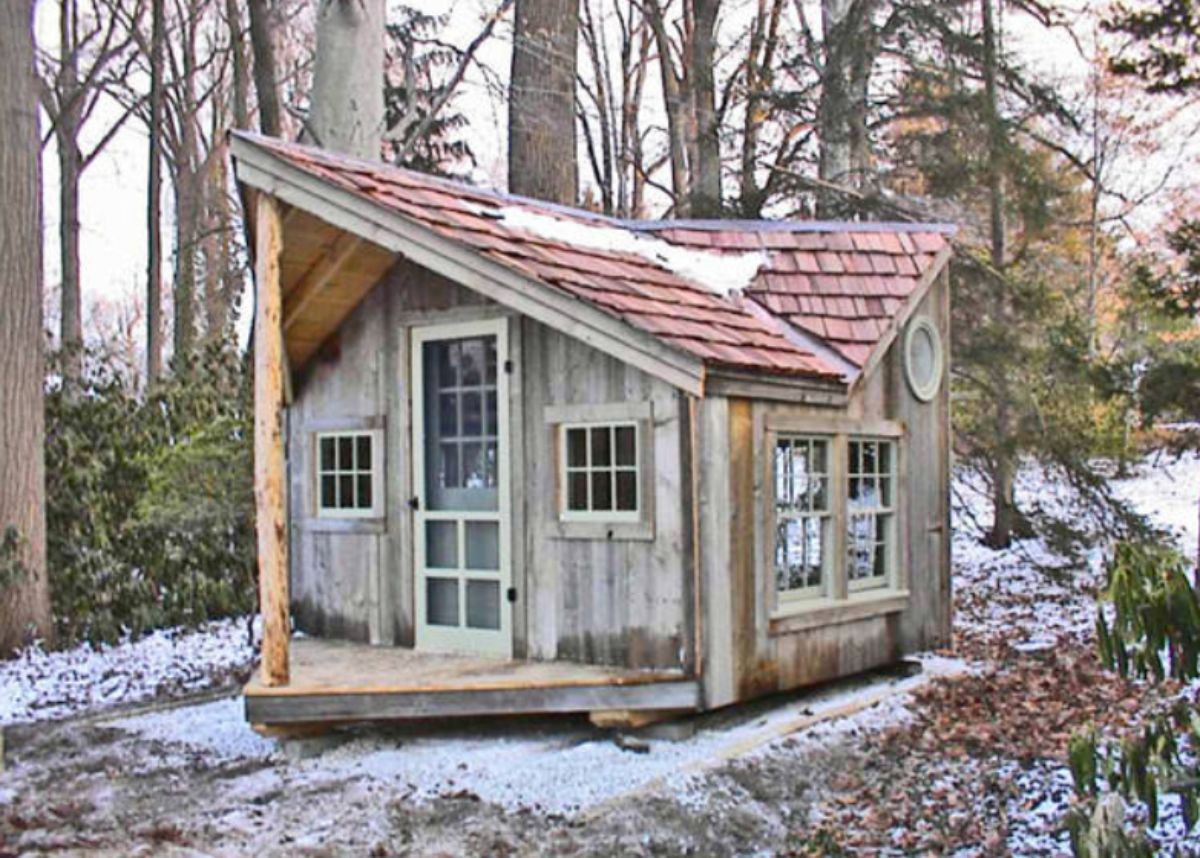 small log cabin in snowy woods