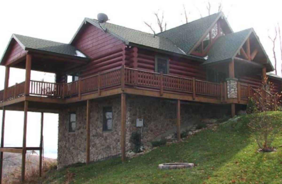 large and dark cabin on a slope