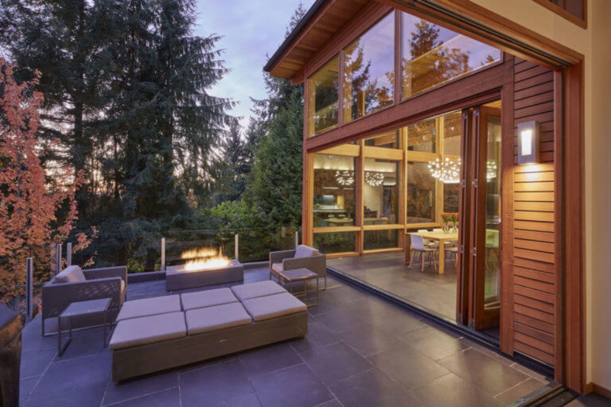 modern log home with a beautiful deck