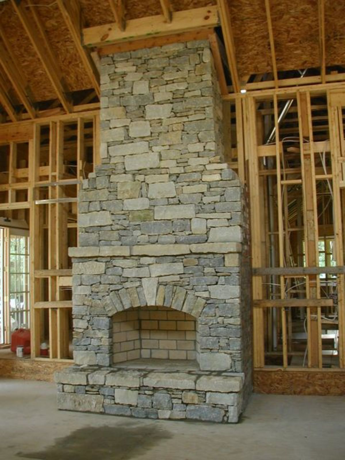 simple design fieldstone fireplace