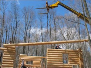 Log home kit at building site