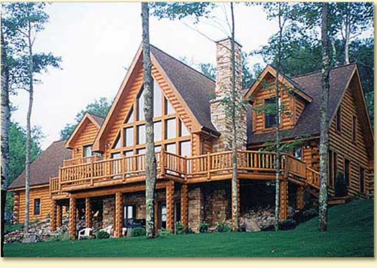 giant log home in a lush setting