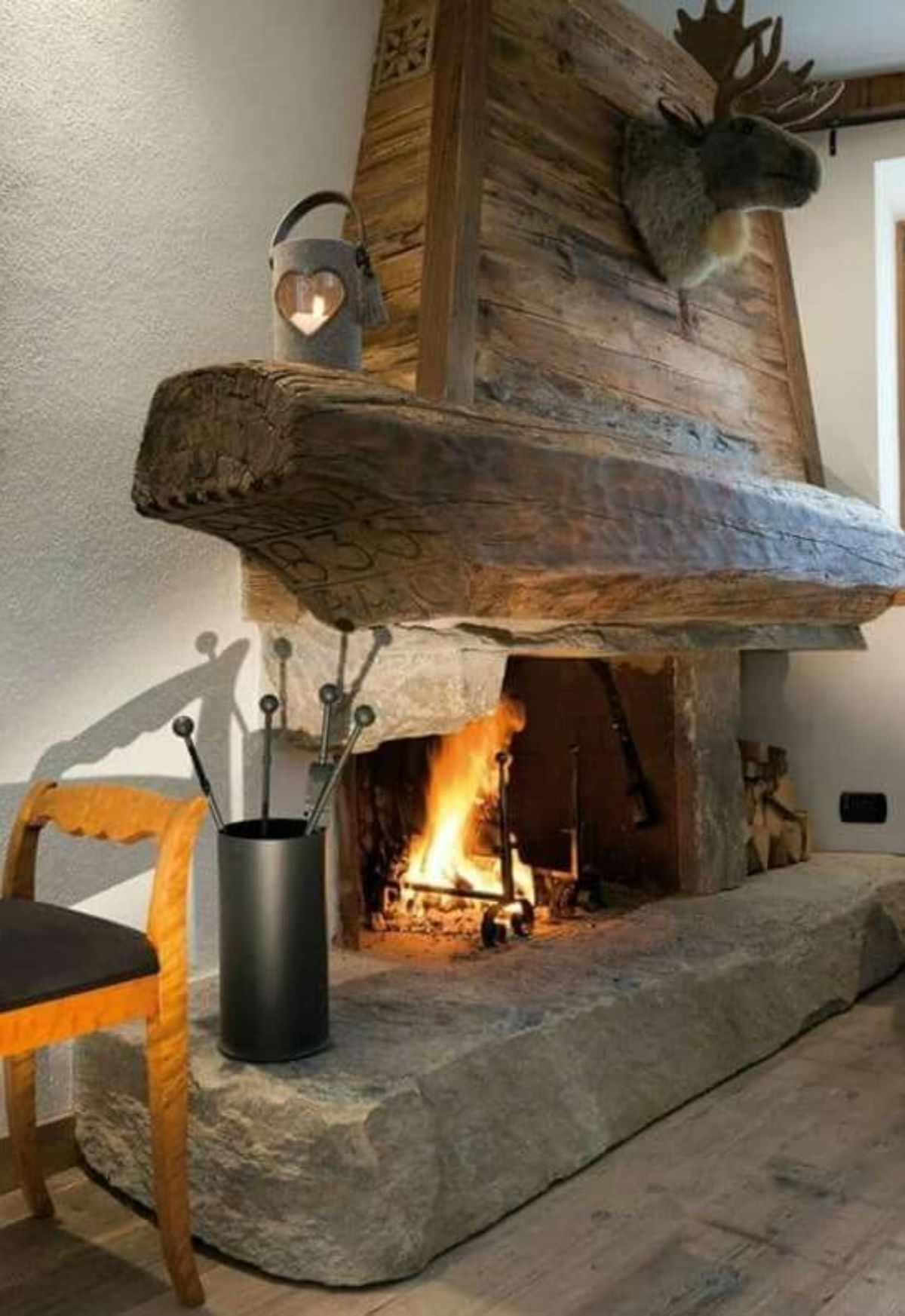 fireplace mantel made of rustic timber