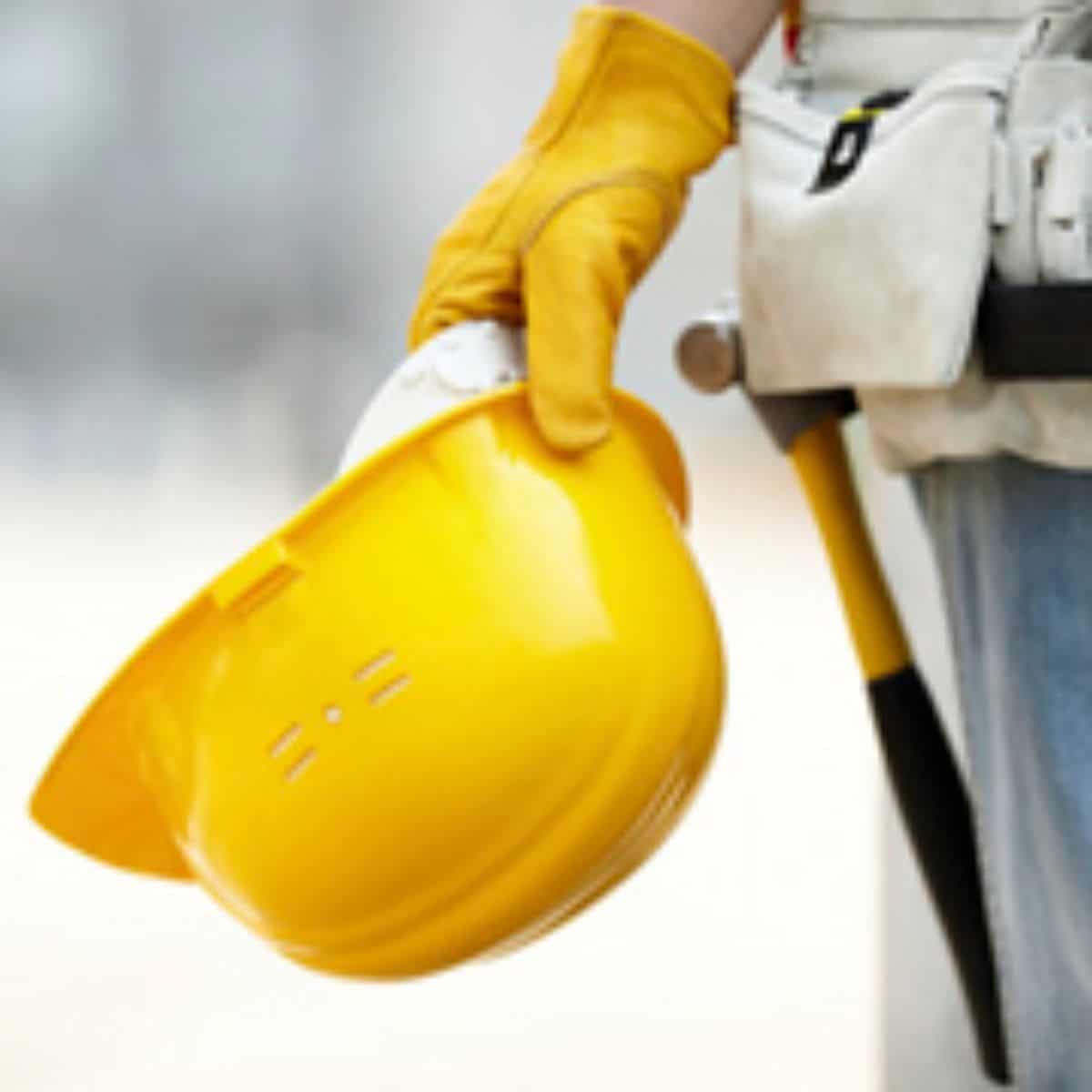 subcontractor holding a hard hat