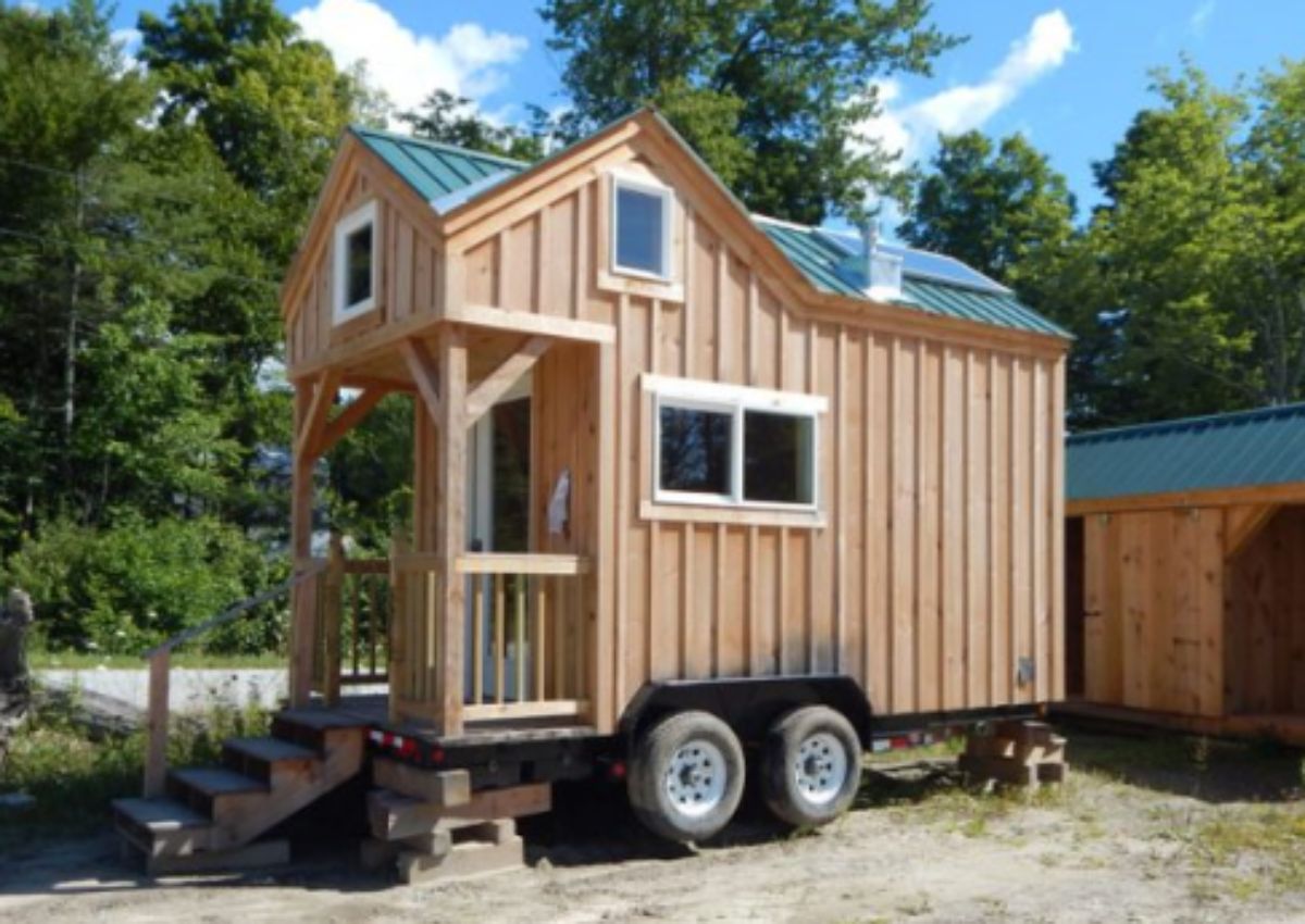 Tiny log house on wheels