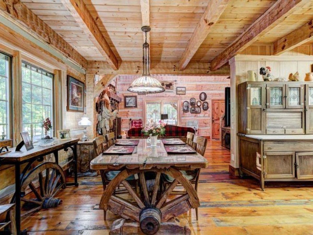 Wagon wheel ends on dining table in log cabin