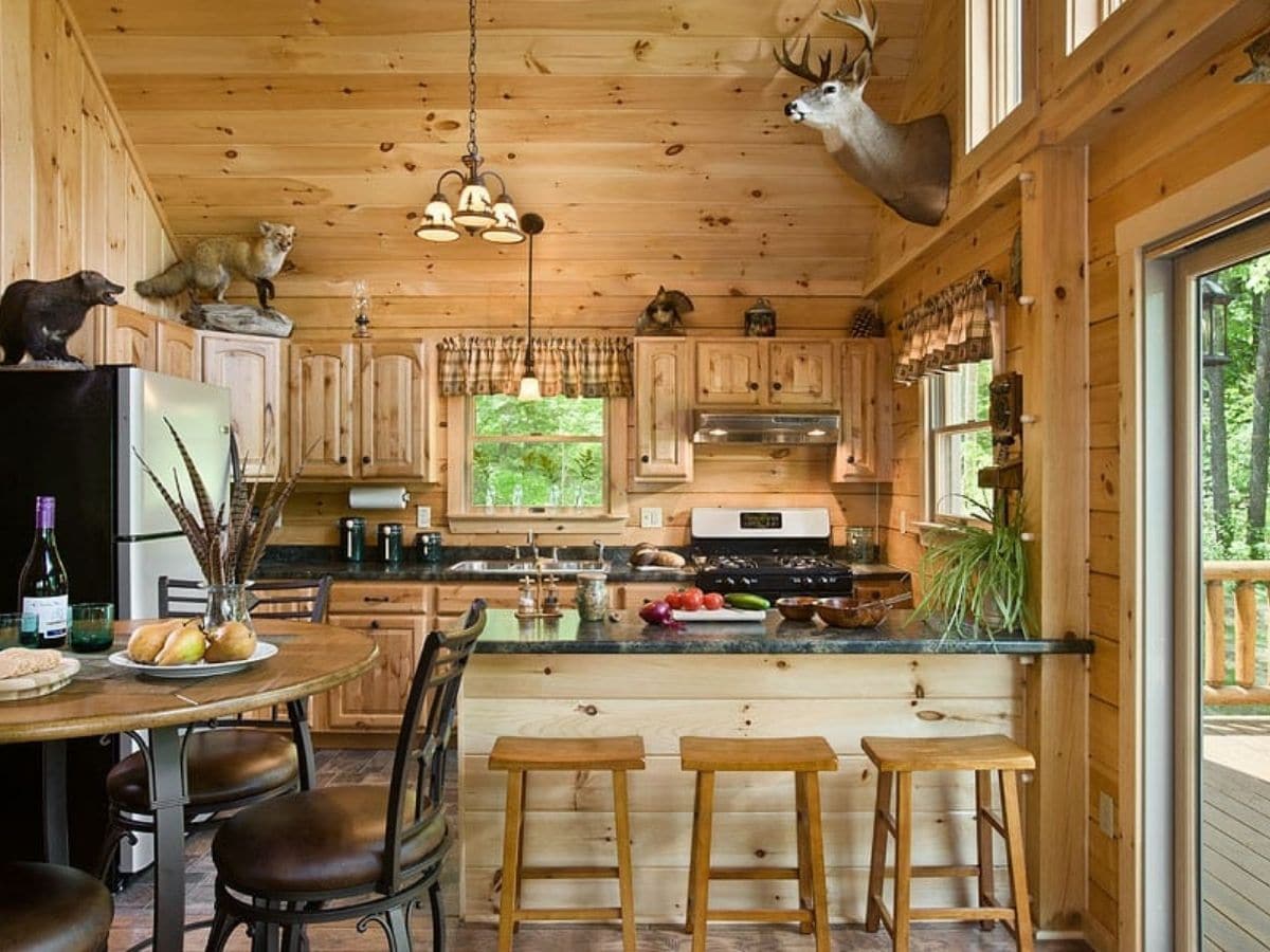 small bar leading to kitchen of log cabin