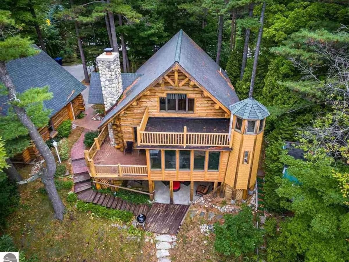view of log cabin in woods from above
