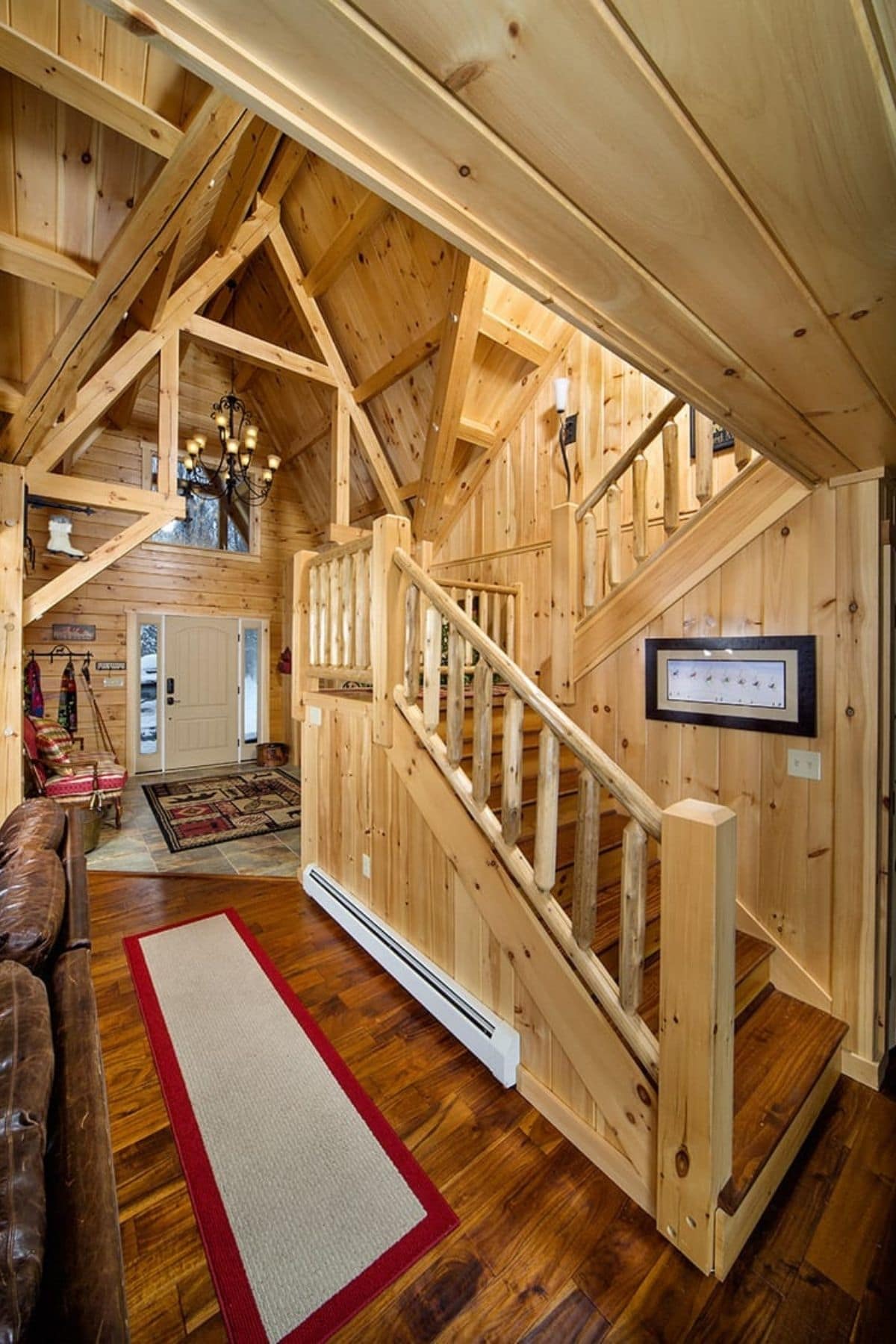 log cabin entry with stairs to loft on right side