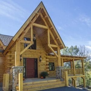 front entry of log cabin on hill