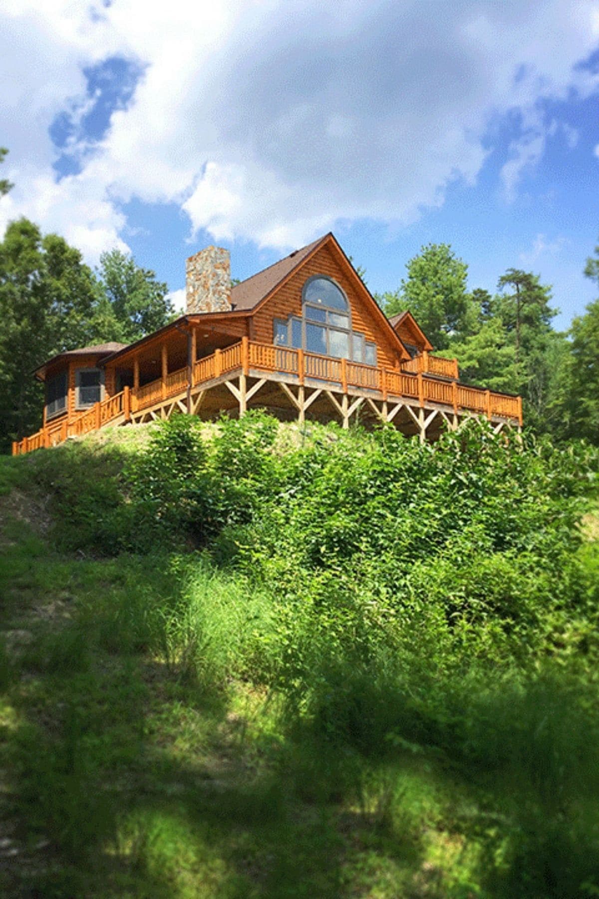 log cabin on top of hill 