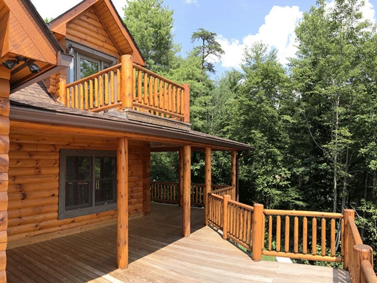 side porch on log cabin overlooking hill