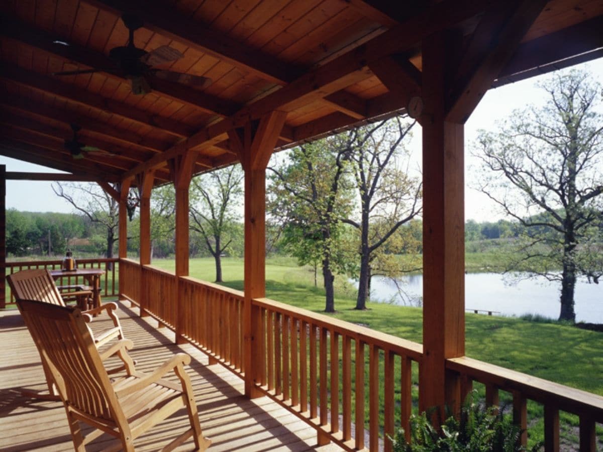 wood beams and railing on porch of log home