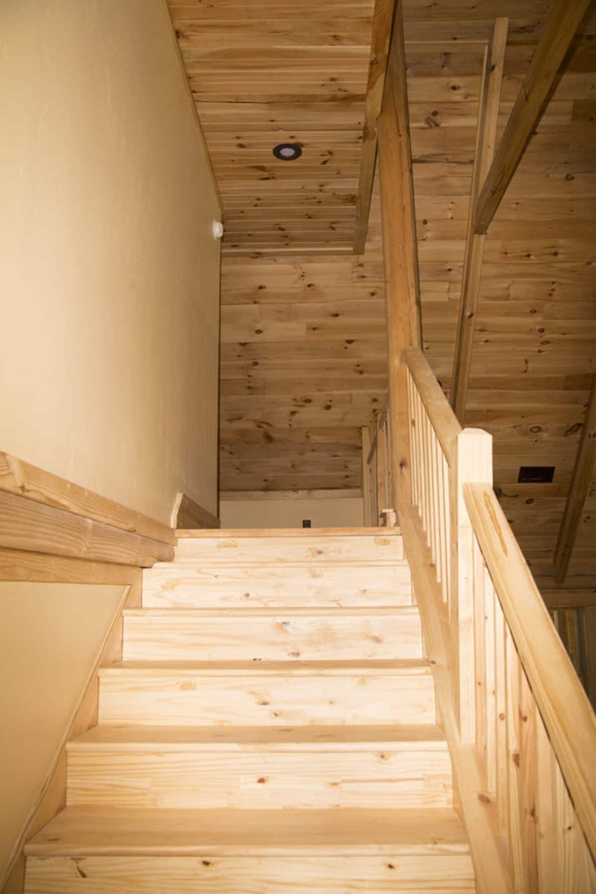 view up wood stairs to loft
