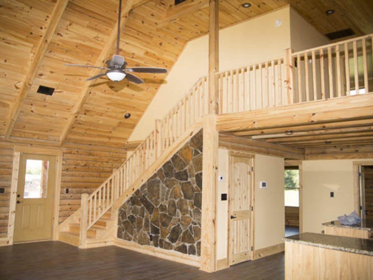 Entry in log cabin with stone accent wall