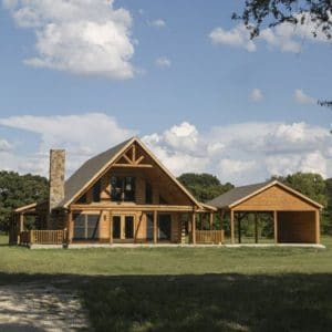 blonde log home with attached carport and porches