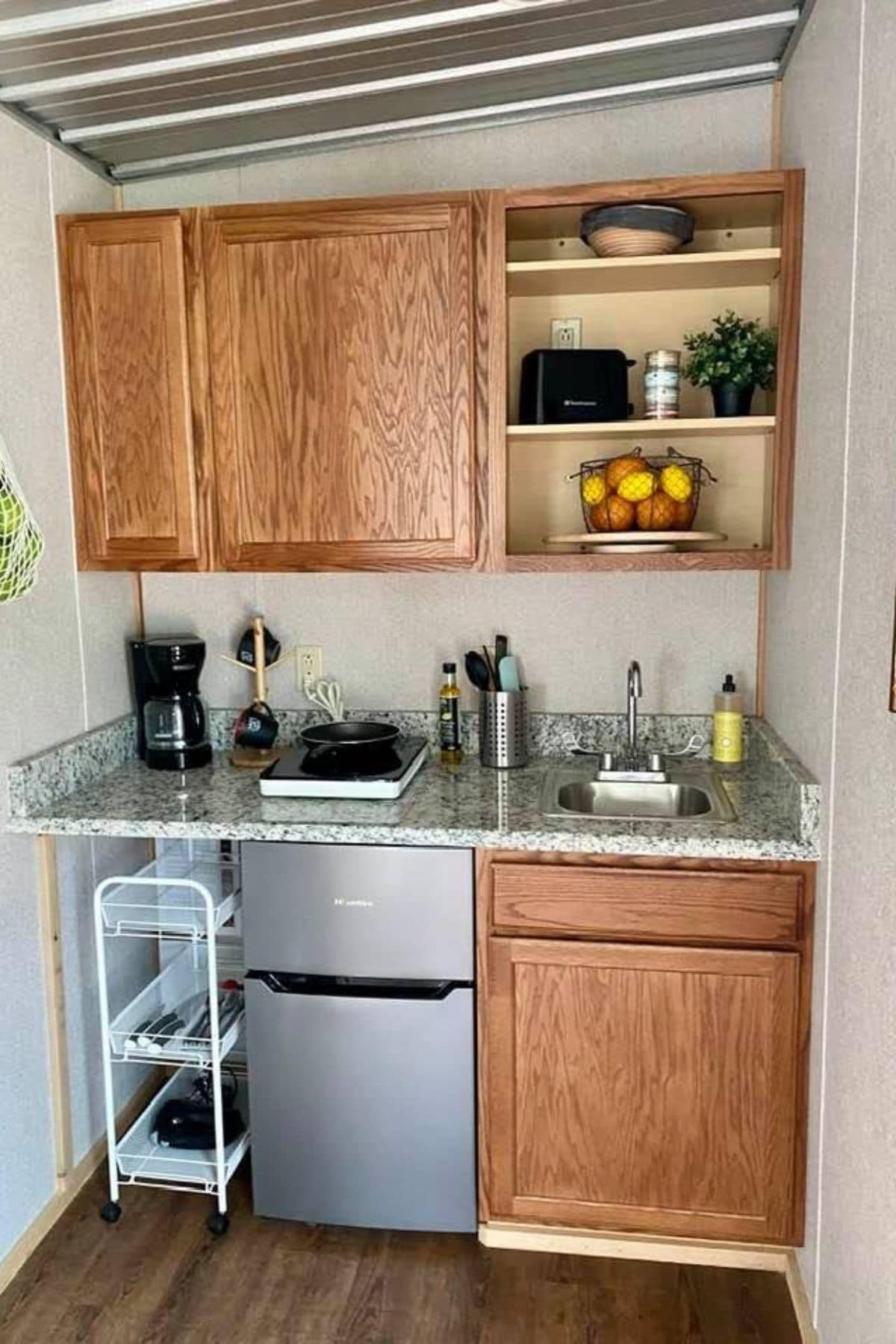 kitchenette against back wall of tiny home