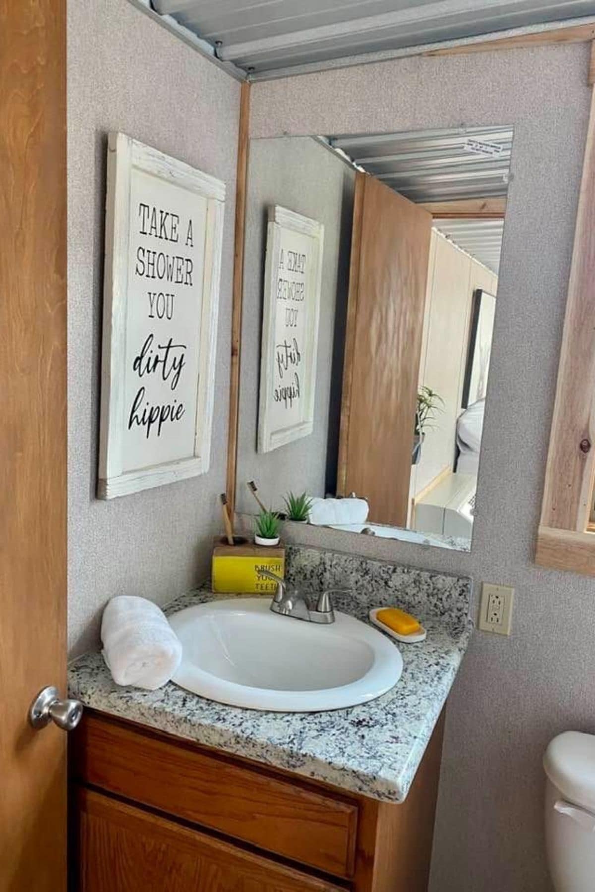 corner sink with wood cabinet beneath