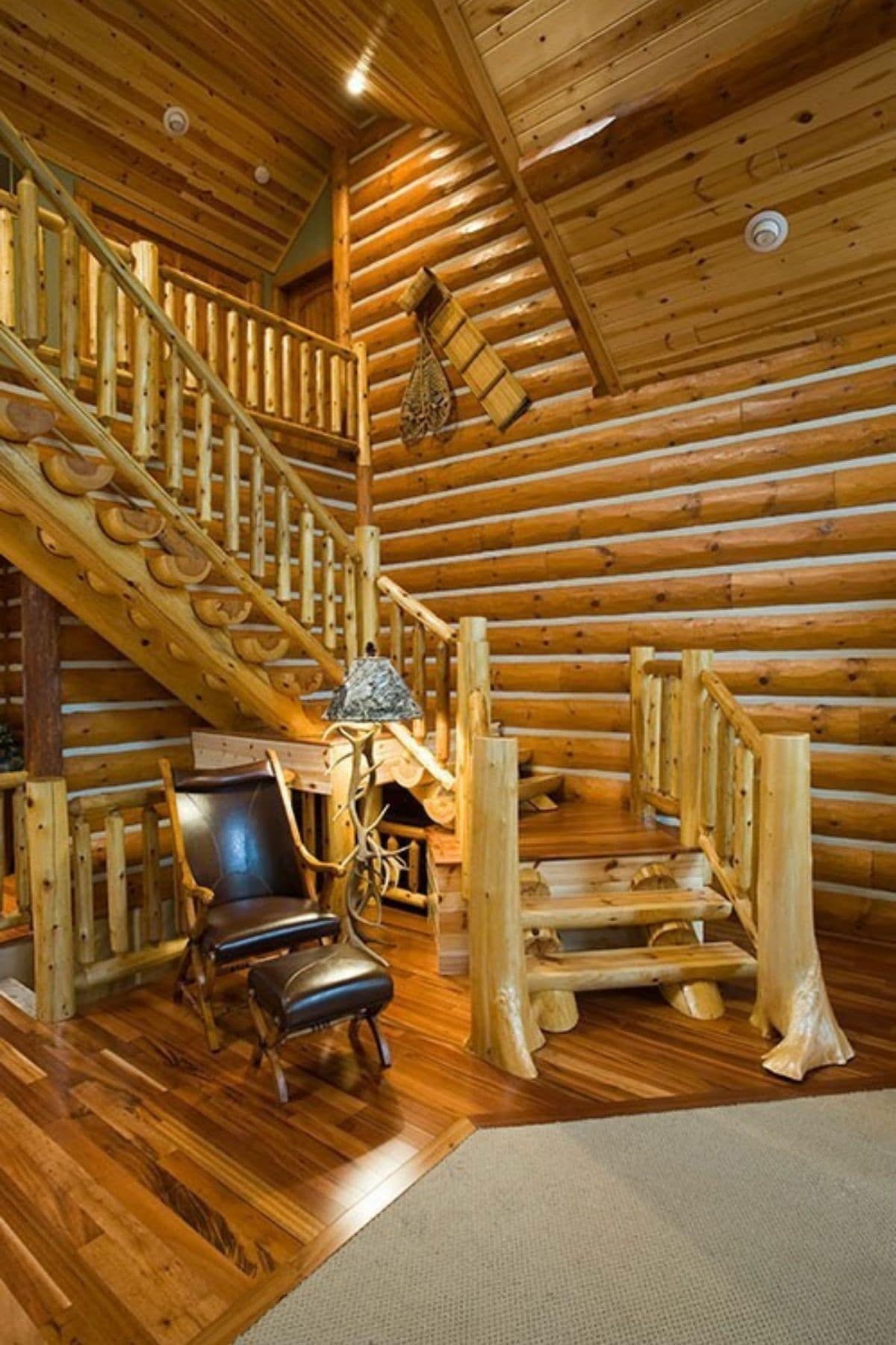 log stairs to second floor of log cabin
