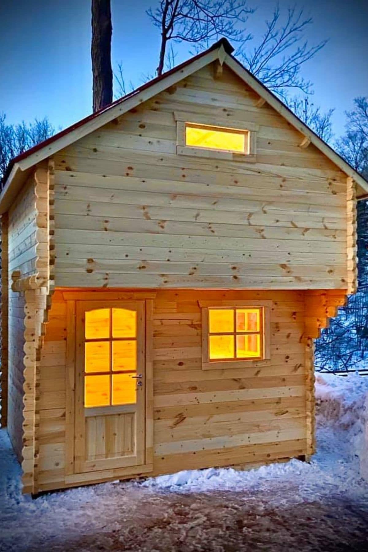 front of small cabin with loft window