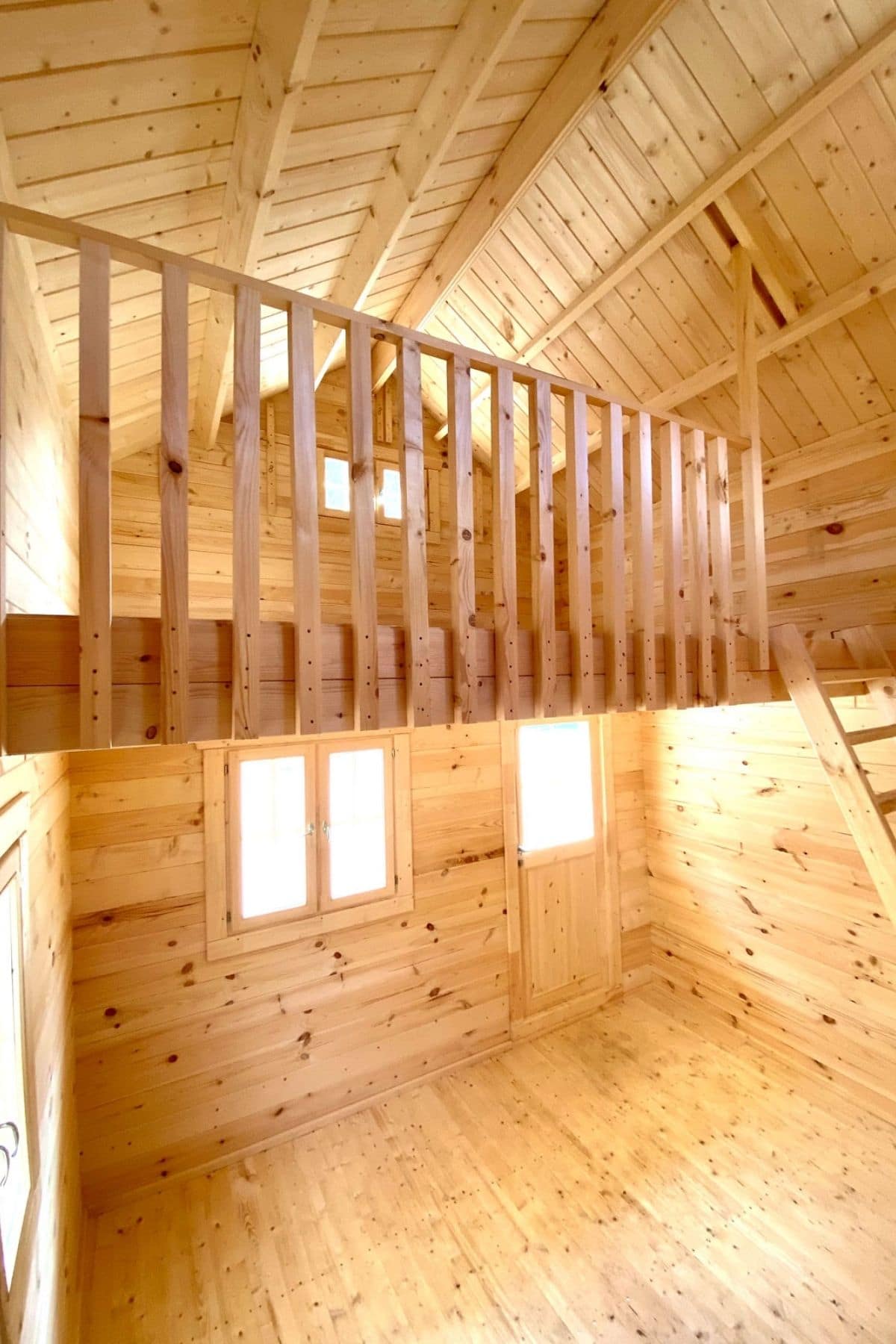 wood railing on loft in hillgrand cabin kit