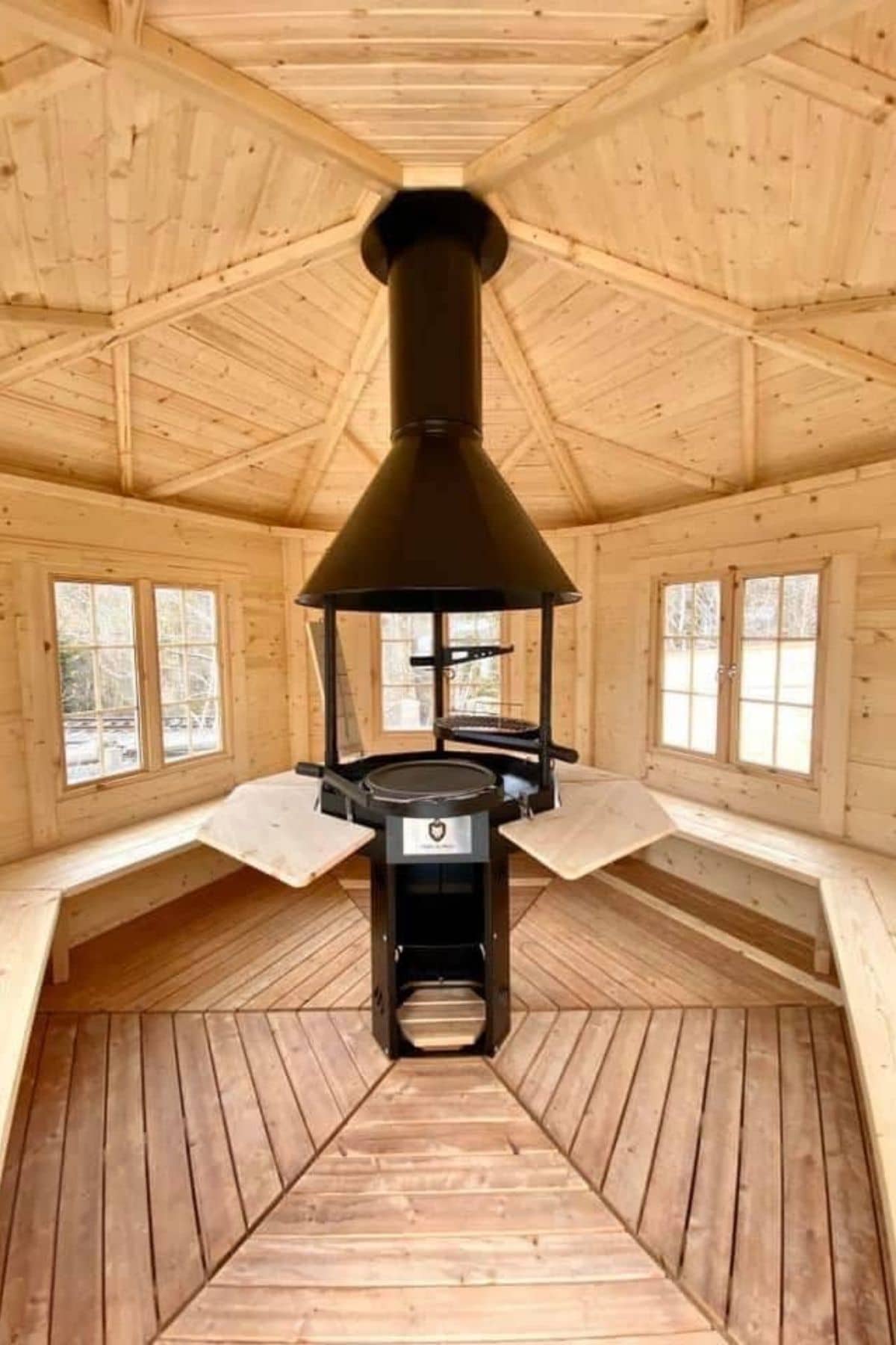 stove in center of log kit hut