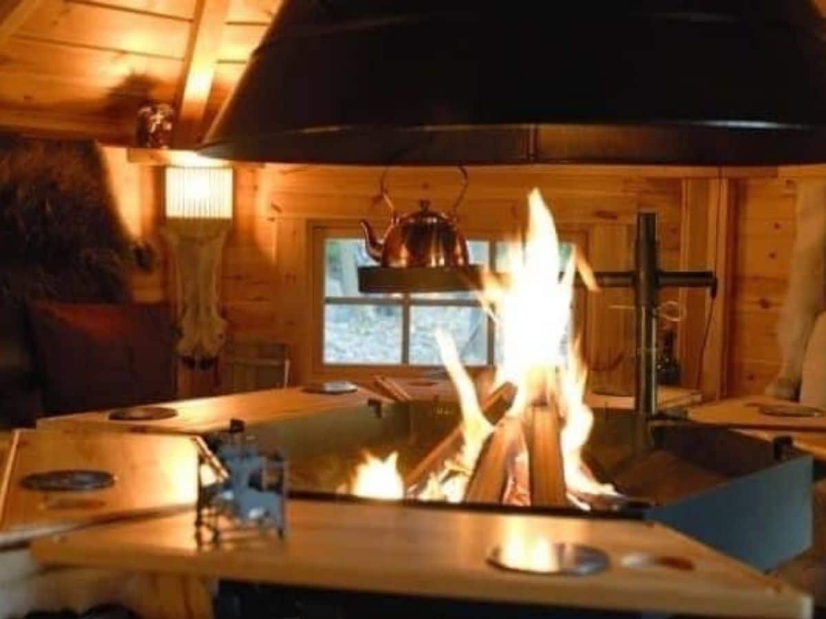 fire pit inside log cabin