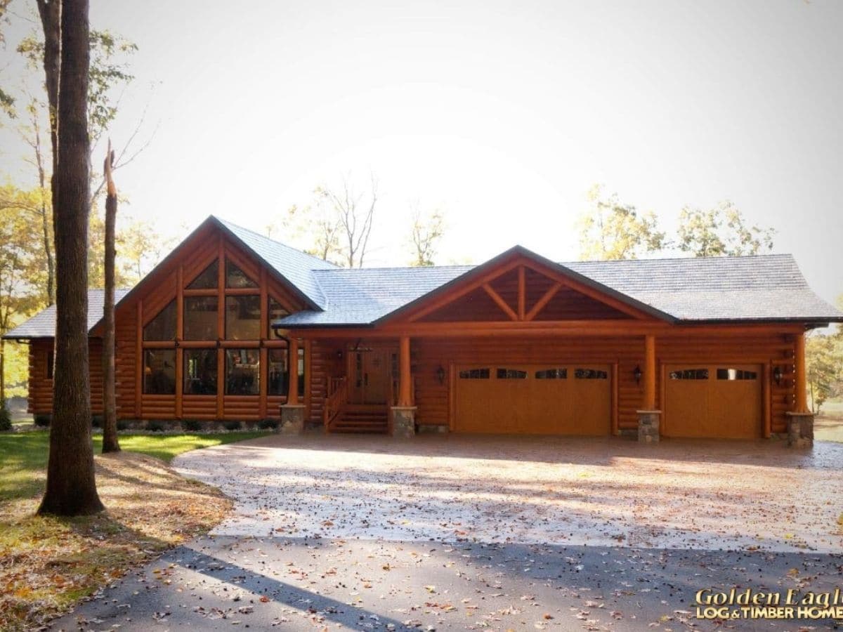 front of log cabin with attached garage