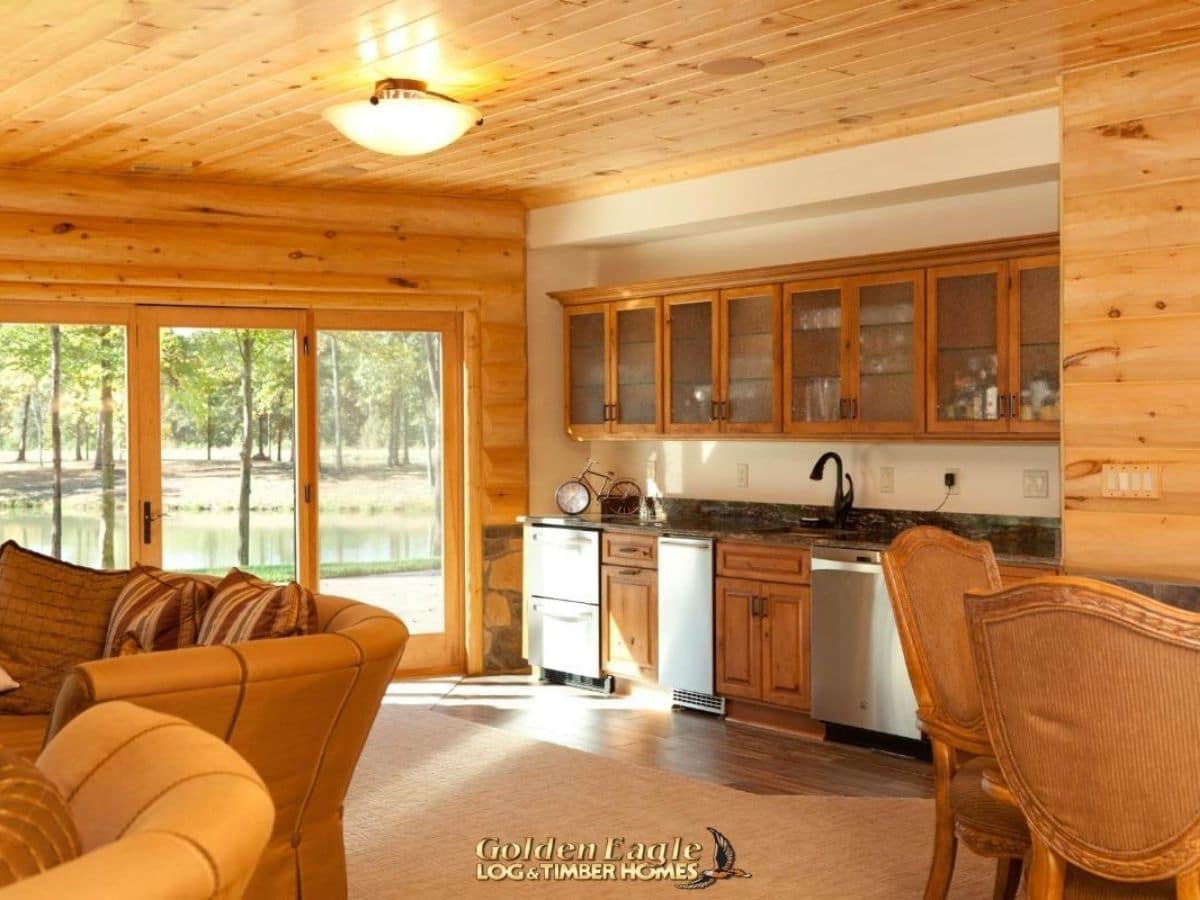 kitchenette against wall behind sofa