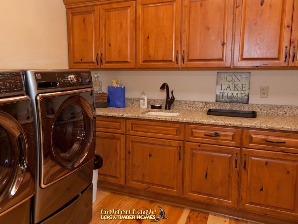 laundry room with wood cabinet storage