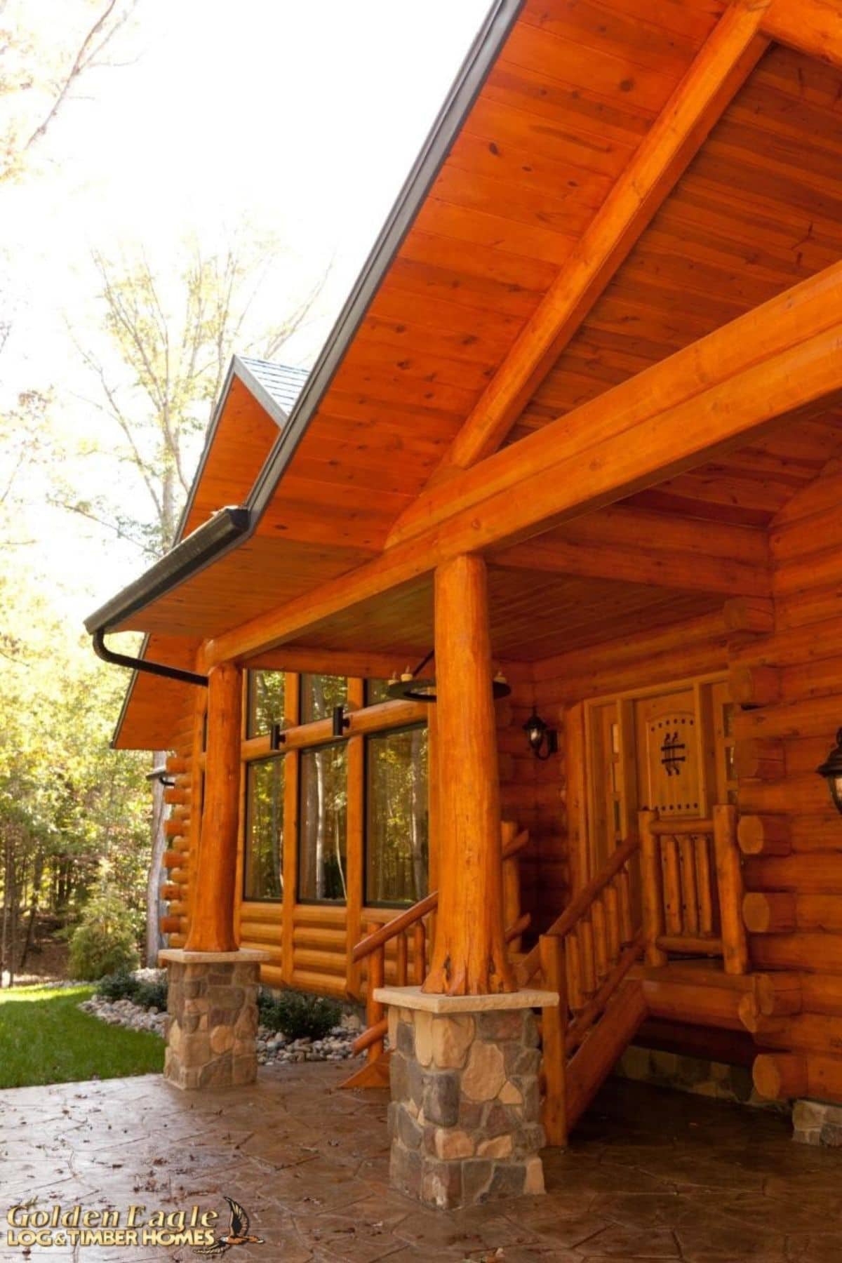 cabin front porch with stone base on pillars