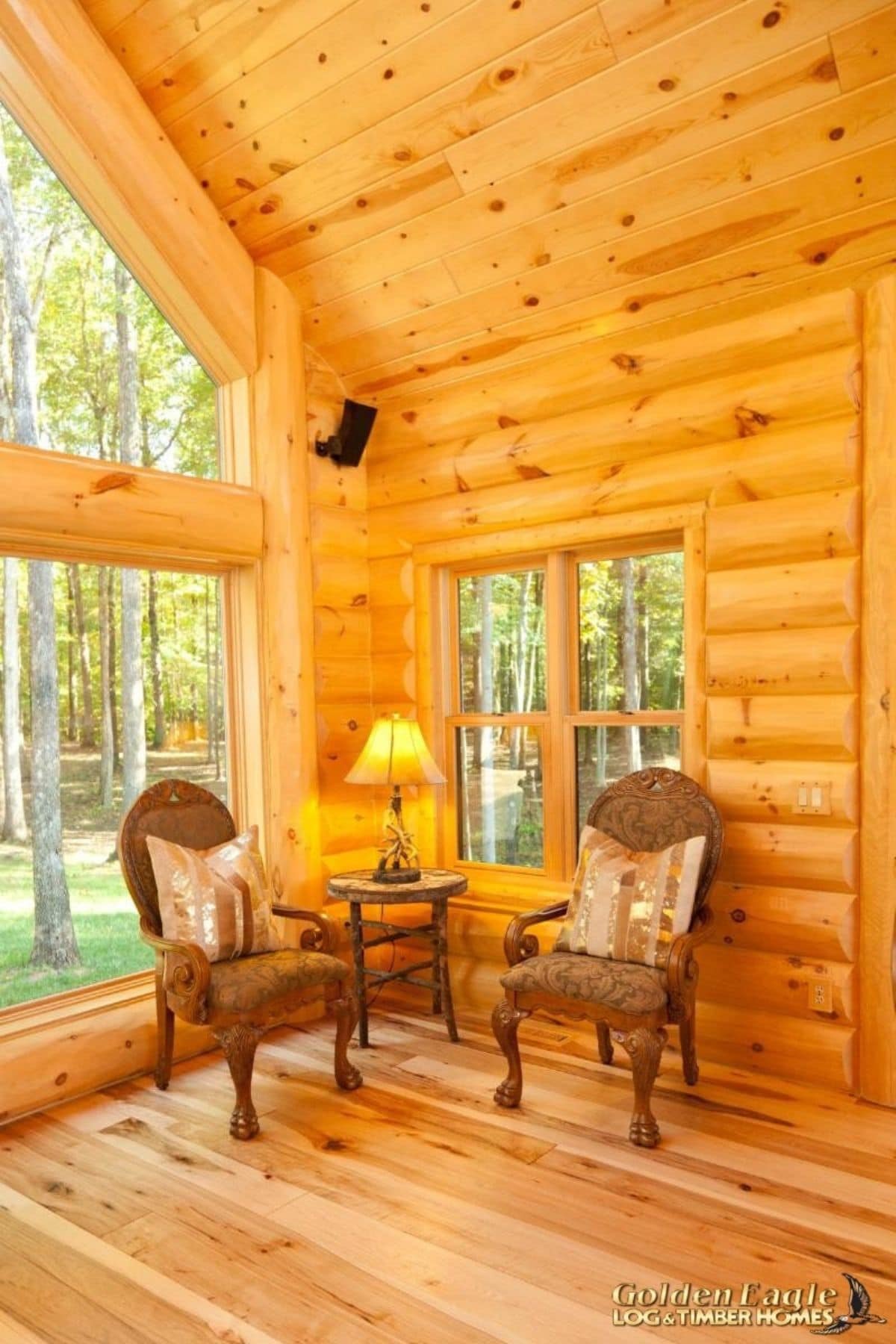 two chairs against window in living room