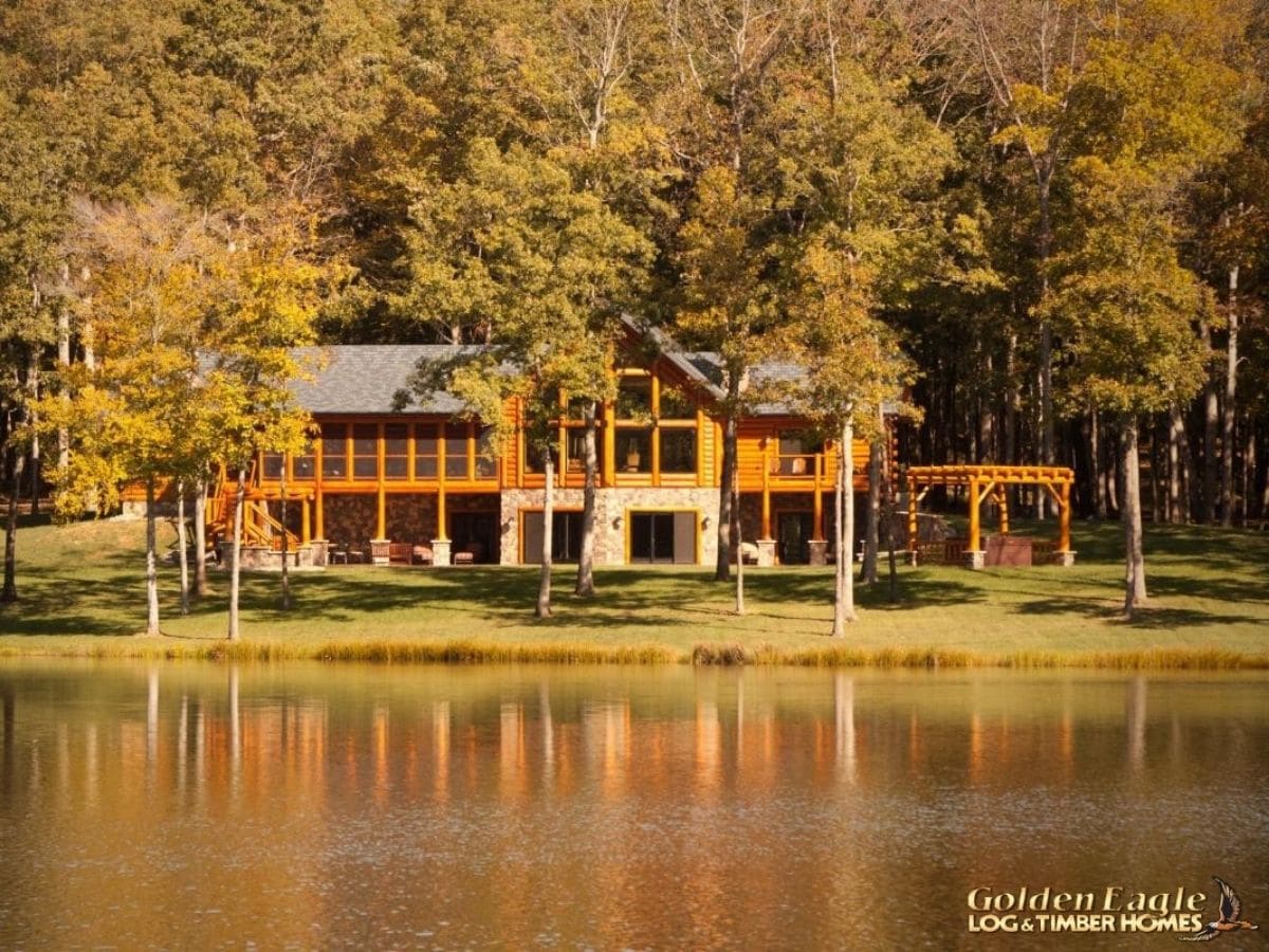 view of cabin across pond