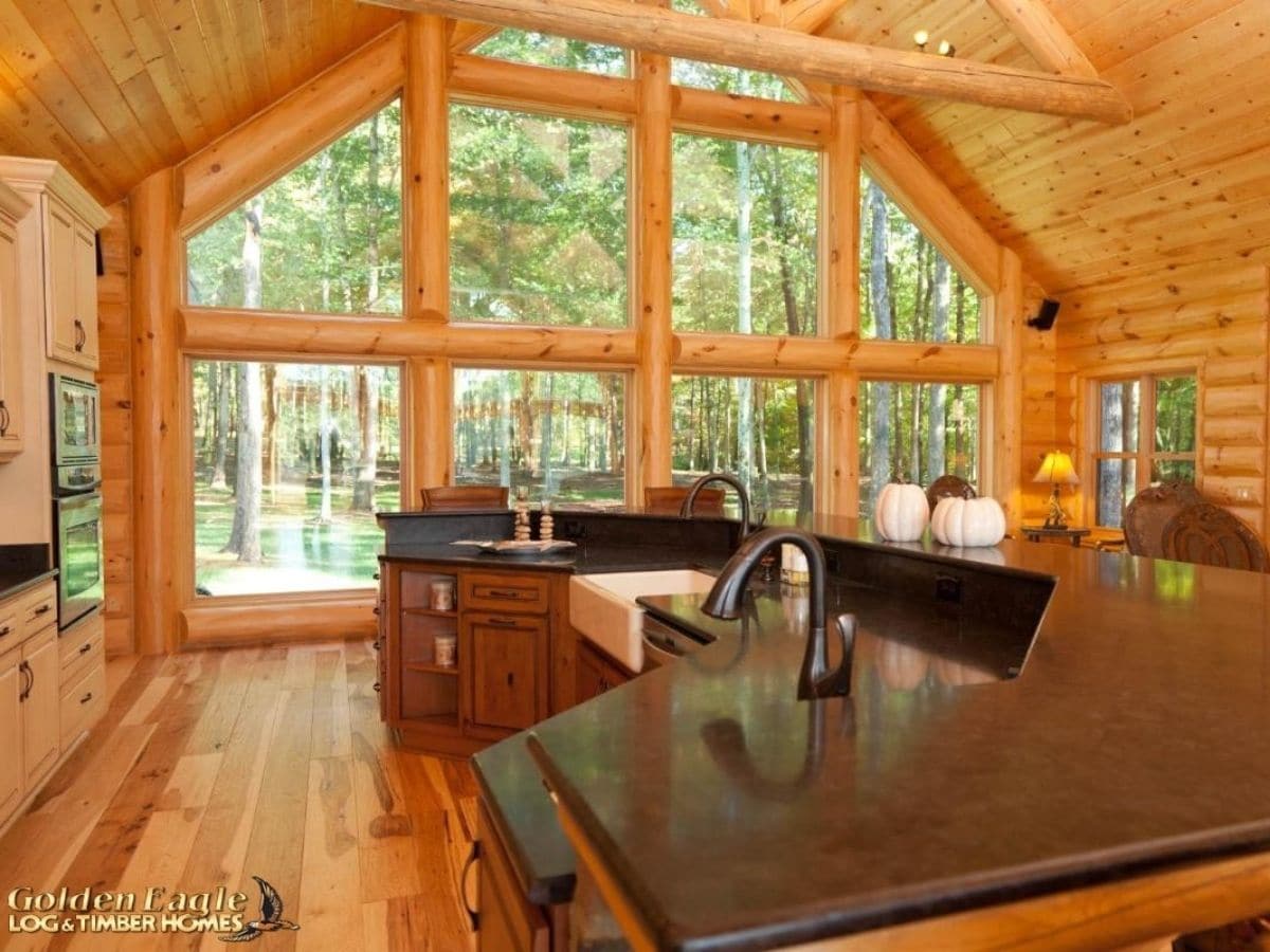 view over island to back glass wall of cabin