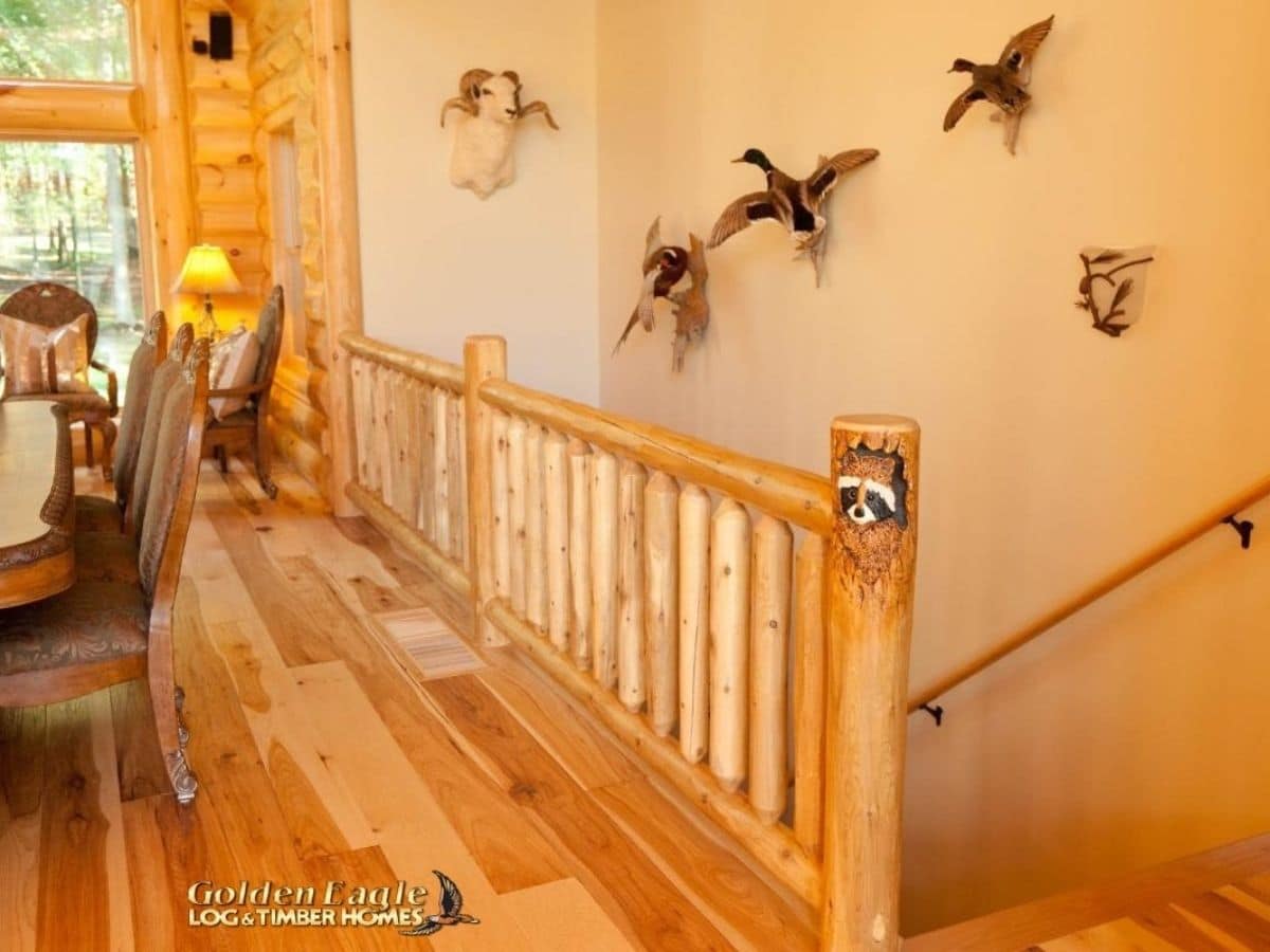 rustic wood railing leading to basement