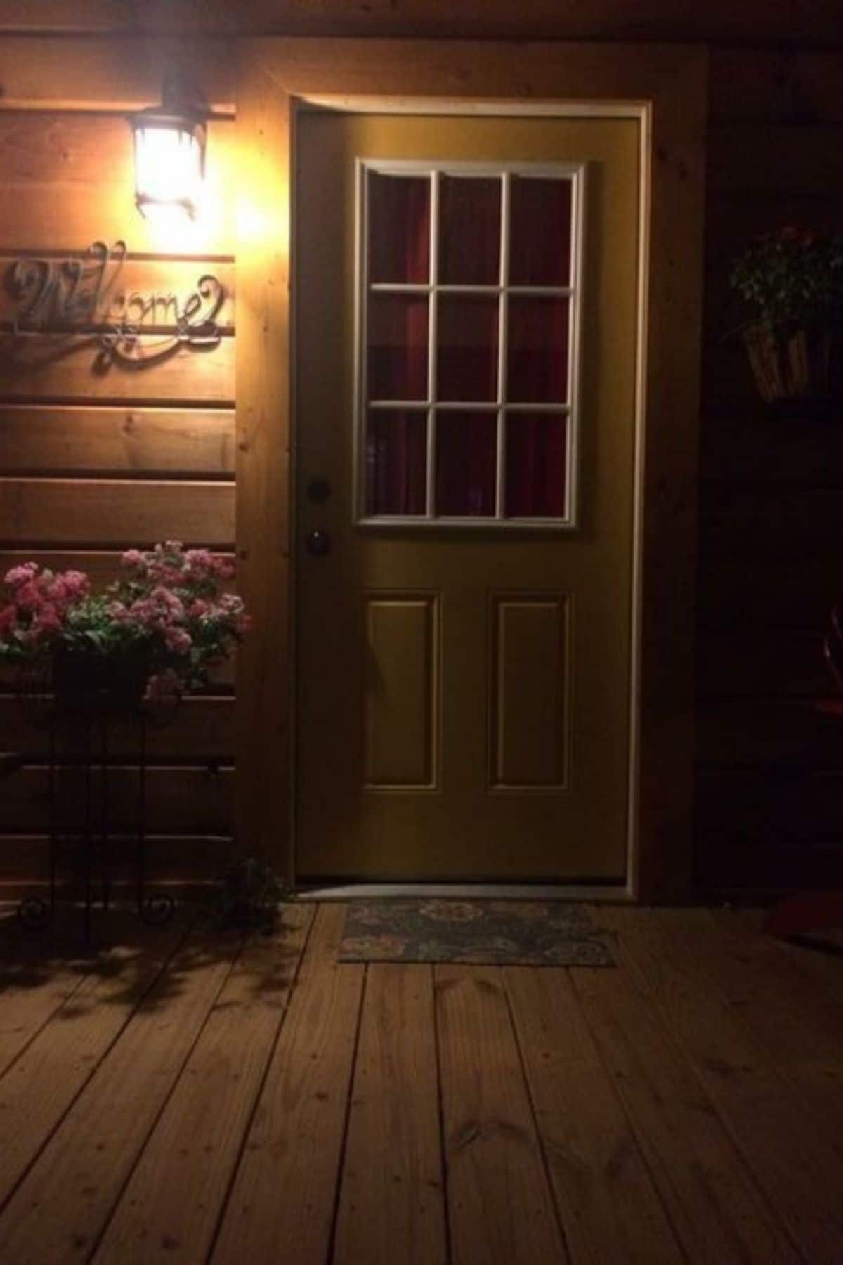 front door after dark with 9 pane window