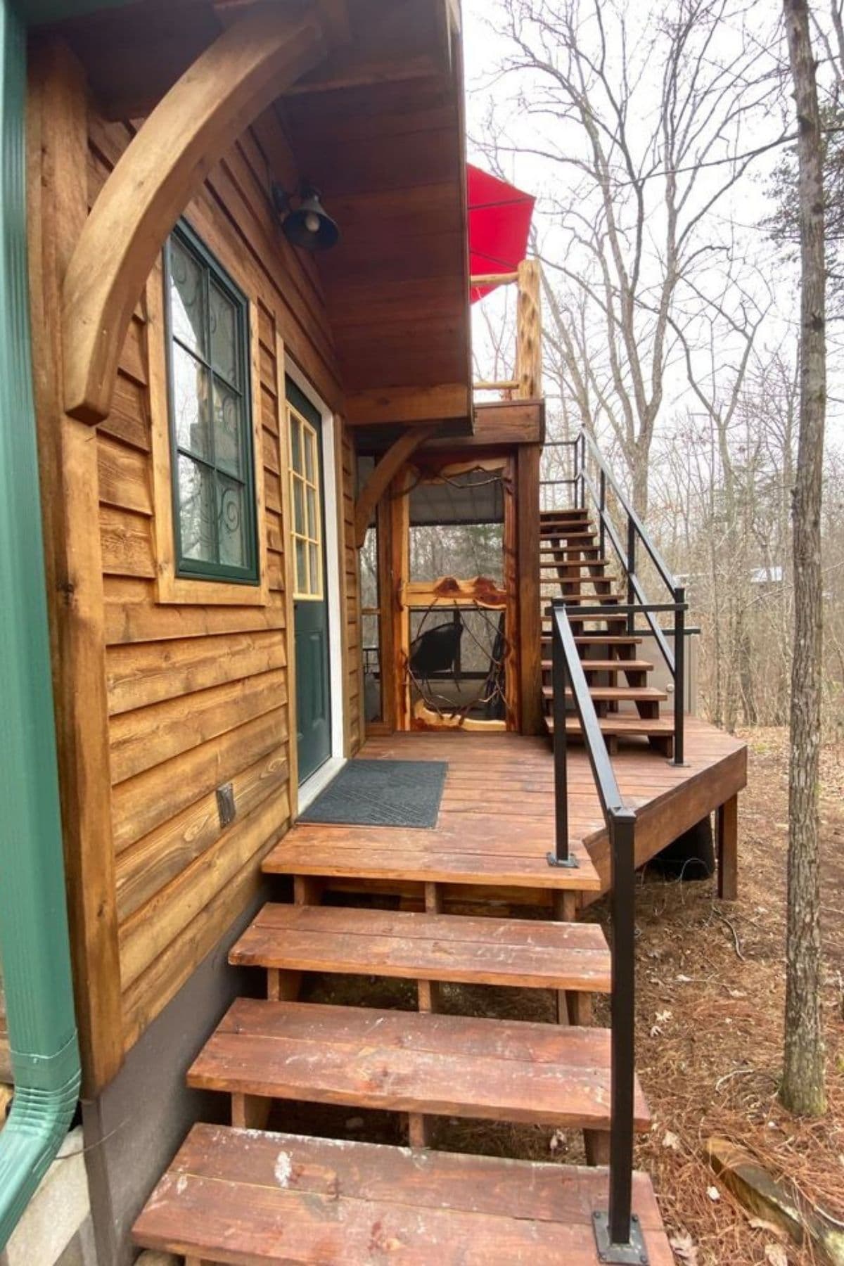 stairs on side of cabin leading to porch