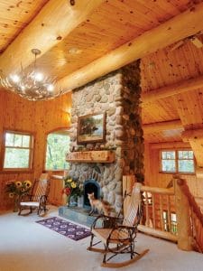 stone fireplace in log cabin