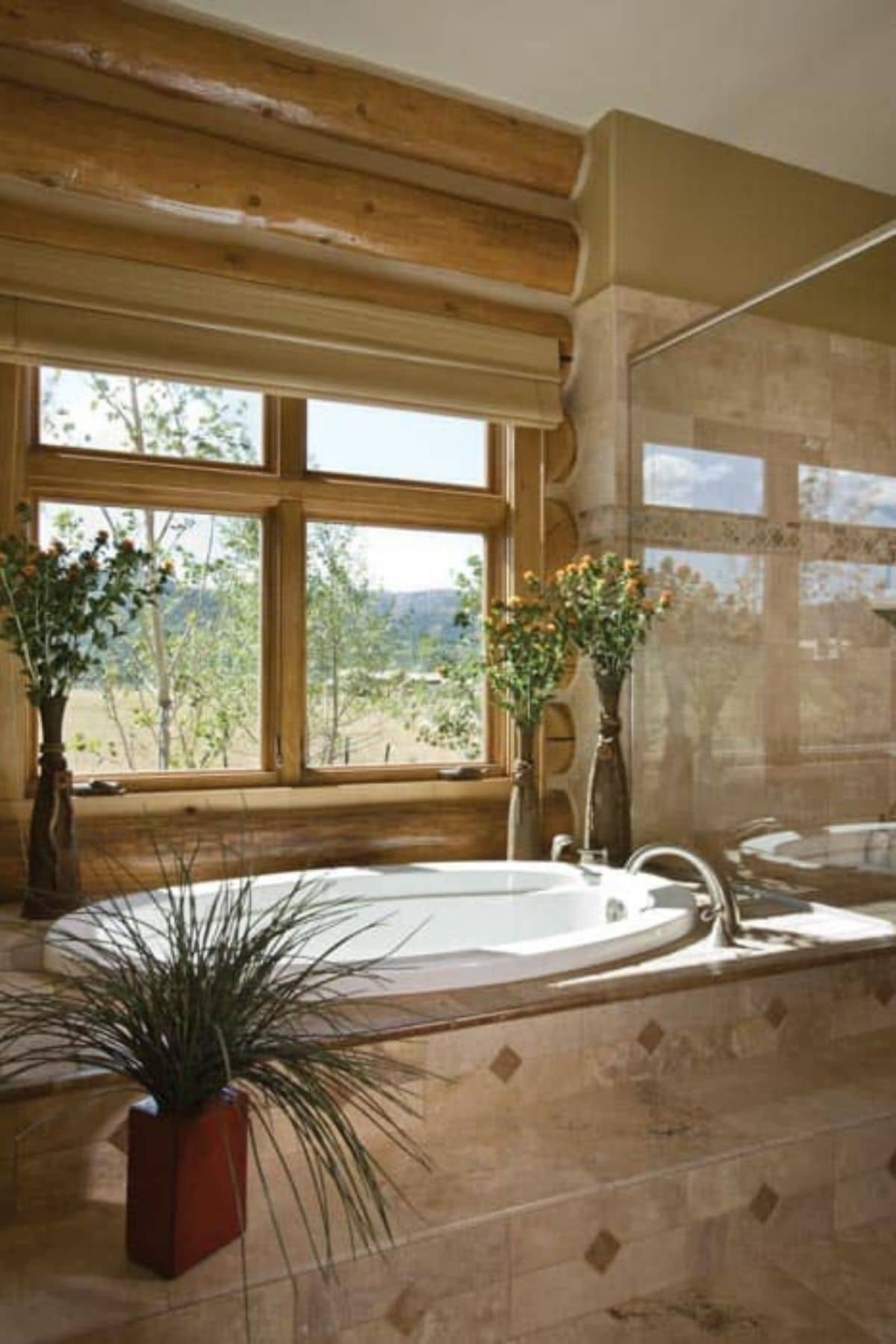 soaking tub in tile space with window in background