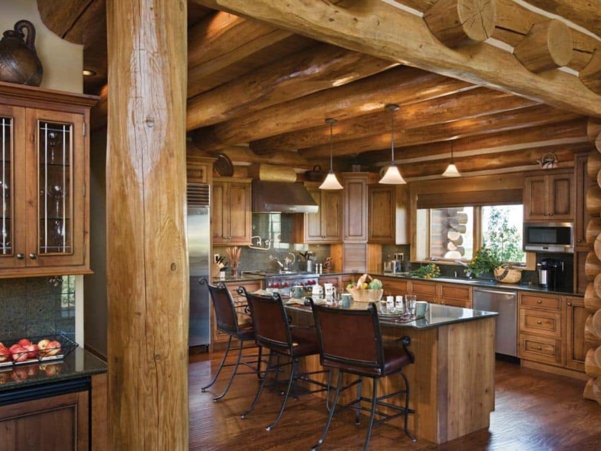 view into kitchen with island bar in foreground