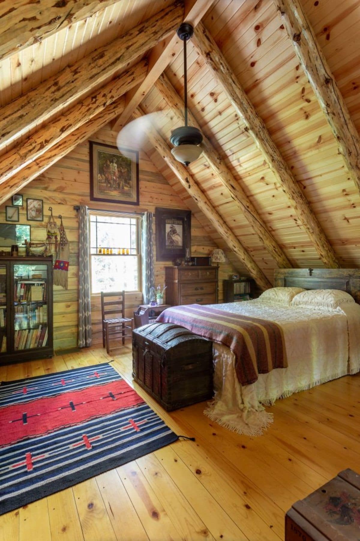 twin bedin loft with trunk at end of bed