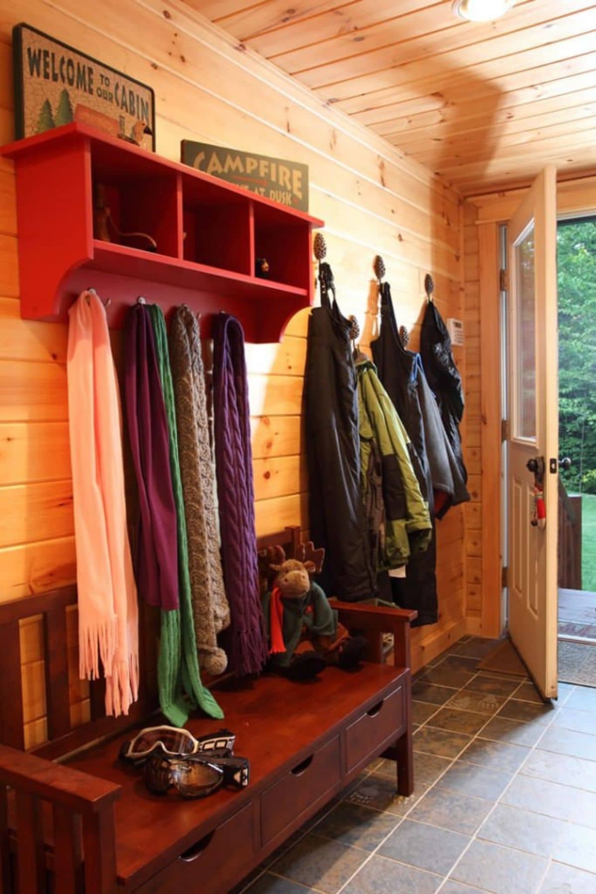 entryway with mud bench and hooks for coats