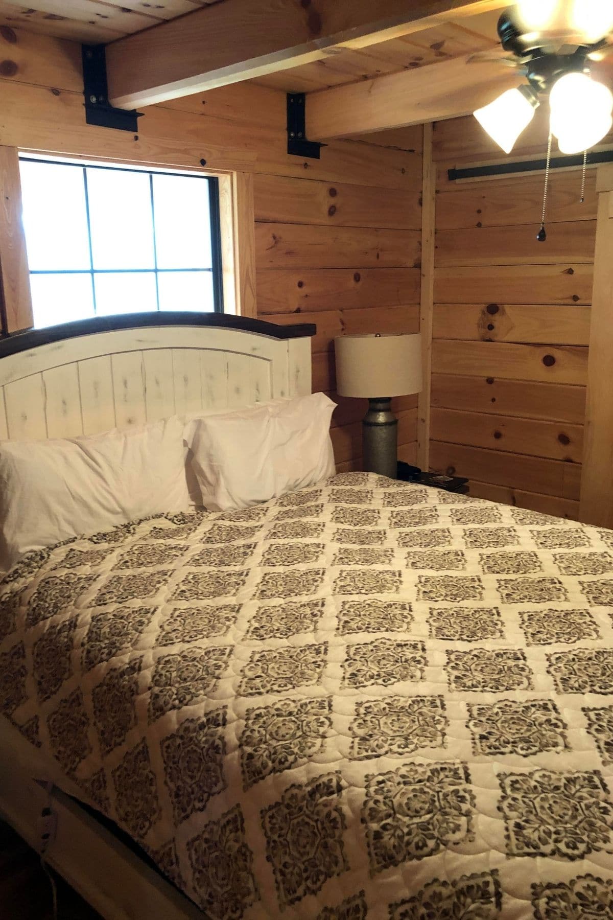 gray and white comforter on bed