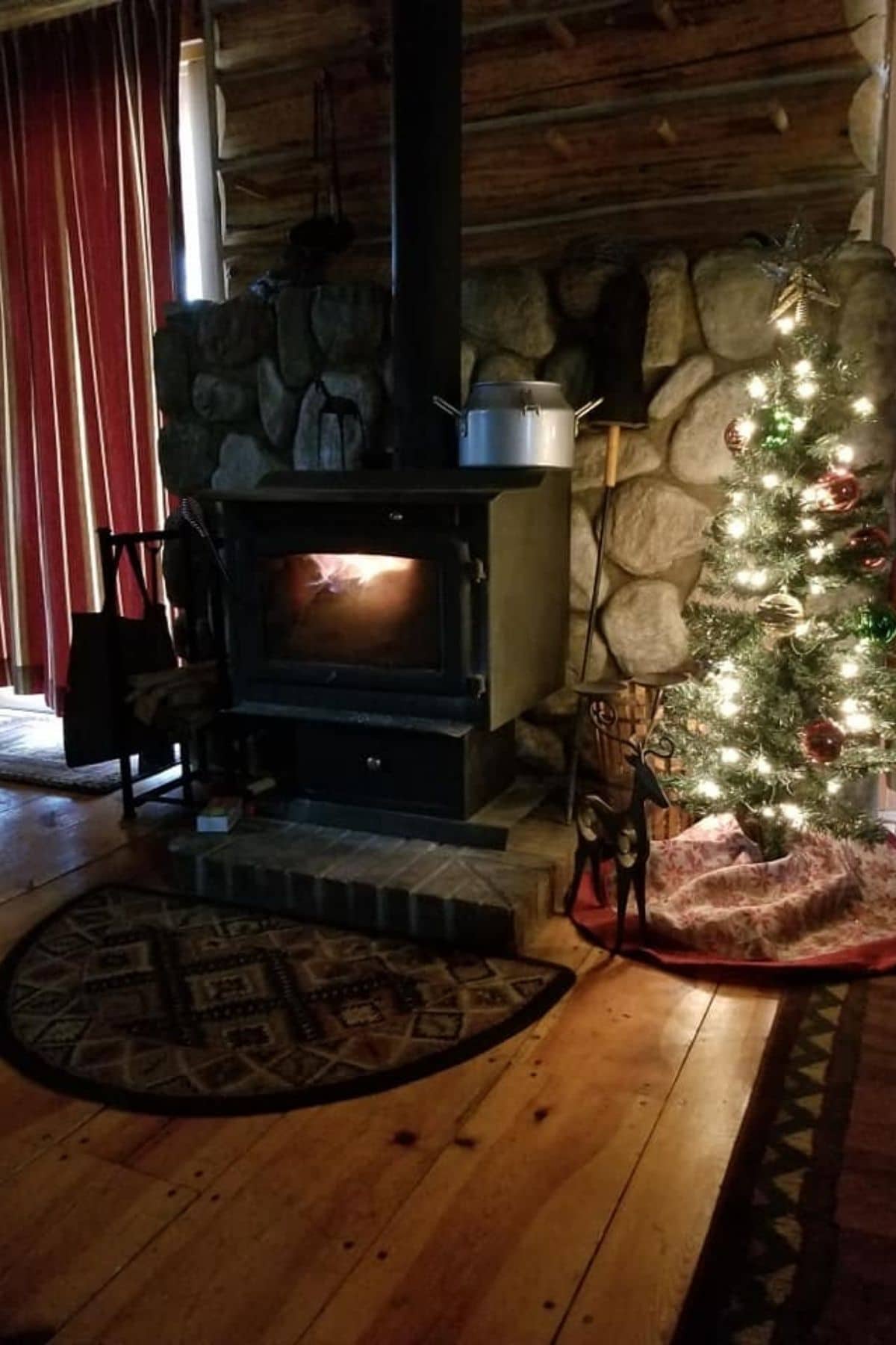 wood stove against rock wall
