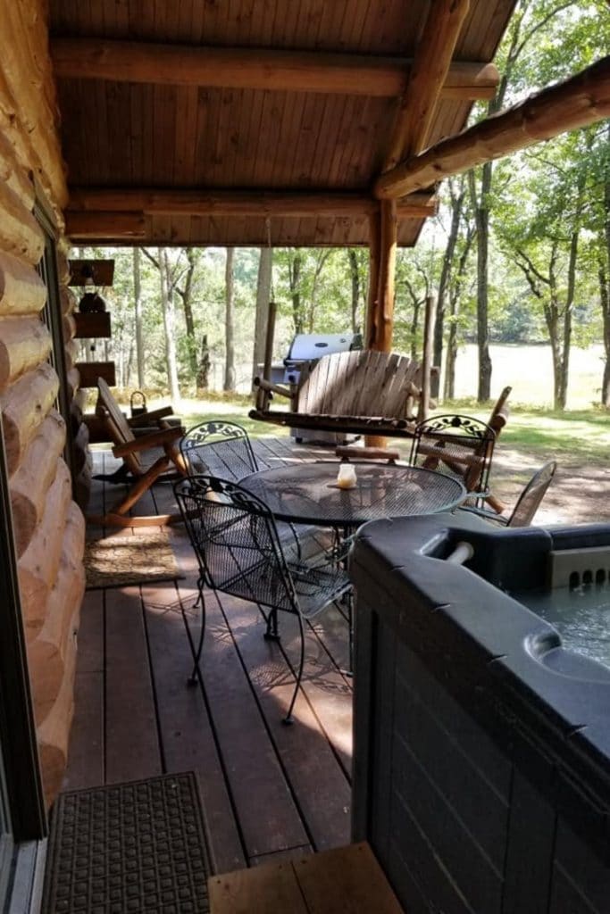 view of porch by hot tub